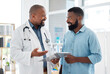 © Nina/peopleimages.com - Doctor, black man and patient with clipboard in consultation, talking or health results in hospital. Healthcare, paperwork and happy medical professional with mature person with checklist in clinic.