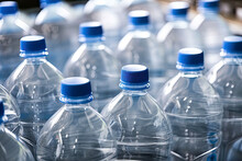 Closeup On Mineral Water Bottles In Raw And Lines