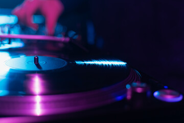 Sticker - Turntable playing analog vinyl record with music on hip hop party in dark night club