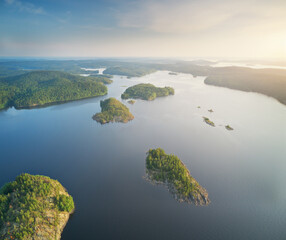 Poster - Island on lake during sunset, aerial view.