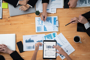 Poster - Top-view closeup business team of financial data analysis meeting with business intelligence, report paper and dashboard on laptop. Business group people working together in harmony office.