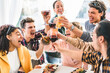 © Nicolas Micolani - Happy group of friends toasting cocktails on holiday at hotel resort terrace-Young multiracial people having fun drinking and cheering glasses together celebrate summer time-Youth Culture-Friendship