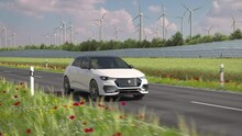 A Generic Electric Car Drives Along A Country Road With Solar Panels And Wind Turbines In Background. Green Energy Concept. Realistic High Quality 3d Rendering Animation. Front View