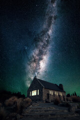 Wall Mural - the church of the good shepherd at lake tekapo in new zealand in front of the rising milkyway