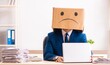© Elnur - Unhappy man employee with box instead of his head