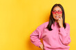 © South House Studio - Young brunette woman looks thoughtfully to the right putting one finger in her mouth, she is faced with a difficult choice of desired company, copy space, high quality photo, business rihgt decision