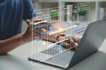 project manager working with gantt chart schedule to update the schedule, management diagram with pl