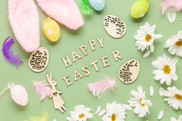 Wall Mural - Easter background with  white chrysanthemums flowers, colored eggs and decorations on color background with text 