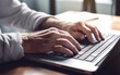 © Malchevska Studio - Senior hands typing on laptop in coffee house setting. Generative AI