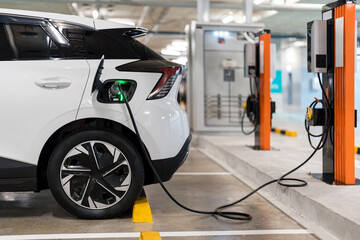 Wall Mural - Charging of electric cars at a charging station, automotive industry, transportation