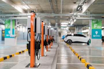 Wall Mural - Charging of electric cars at a charging station, automotive industry, transportation