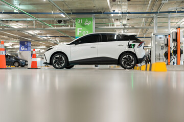 Wall Mural - Charging of electric cars at a charging station, automotive industry, transportation