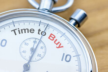 Time To Buy Assets Or Invest In Long-term Value Stocks, Financial Concept : Closeup Of A Stopwatch Showing The Word Time To Buy. Purchasing An Asset Requires Precise Timing To Make The Greatest Money.