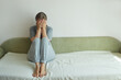 © evafesenuk - Melancholic mature woman crying covering her face