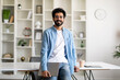© Prostock-studio - Portrait Of Handsome Indian Male Freelancer With Laptop Posing At Home