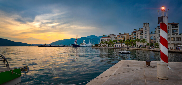 Wall Mural - Evening panoramic view of the sea port of Montenegro.,Tivat. Luxury yachts and sailing boats in the port of Montenegro. Tivat. Kotor bay, Adriatic sea.