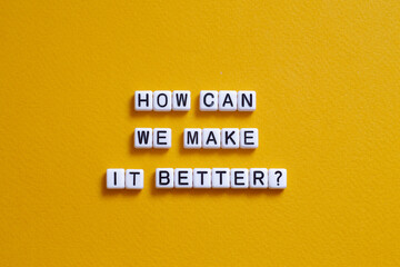 How can we make it better - word concept on cubes, text