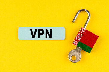 Poster - On the yellow surface is an open lock with a key and a sticker with the inscription - VPN