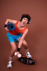 Retro style. A young attractive guy is doing aerobics.