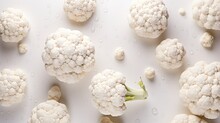 Cauliflower With Drops Of Water On A White Background