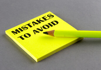 Poster - MISTAKES TO AVOID text written on a sticky on grey background