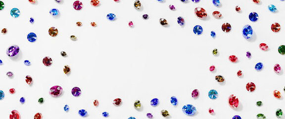Poster - Colorful Gemstones crystal diamond top view placed on white background with frame copy space 3d rendering