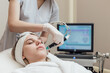 © Oleksandr Kozak - Face Skin Care. Woman Getting Facial Hydro Microdermabrasion Peeling Treatment