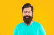 © be free - crying bearded man isolated on yellow. bearded man in studio. bearded man on background.