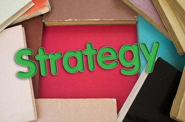 Poster - Strategy word in opened book with vintage, natural patterns old antique paper design.