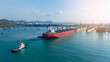 © Yellow Boat - Tug boat Draging cargo container ship to dry dock concept maintenance service working in the sea. Insurance and Maintenance Cargo Ship concept. Freight Service maintenance Insurance