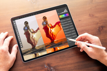 Leinwandbilder - Photographer editing photo on digital tablet, before and after color correction