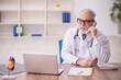 © Elnur - Old male doctor in telemedicine concept