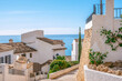 © vejaa - Altea old town with narrow streets and whitewashed houses. Architecture in small picturesque village of Altea near Mediterranean sea, Alicante province, Valencian Community, Spain