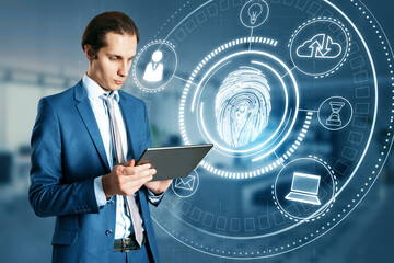 Aufkleber - Attractive young caucasion businessman using tablet with glowing fingerprint hologram on blurry office interior background. Access to the personal information concept. Double exposure.