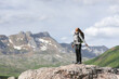 © Antonioguillem - Hiker breathing fresh air on the top of a mountain