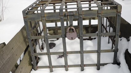 Poster - Antique metal cage with lock in wagon in winter