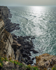 Wall Mural - ocean waves approachoing rocky coastline . beautiful nature background.
