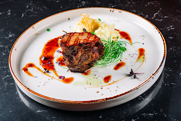 Wall Mural - Grilled beef steak filet mignon with potato and sauce in plate