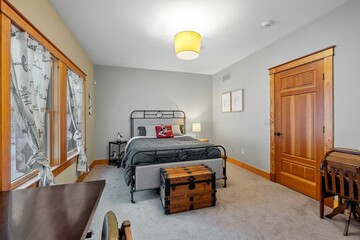 Poster - Bedroom of a contemporary rustic home in the mountains