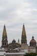 Exterior of Guadalajara Cathedral in Guadalajara, Mexico under cloudy sky