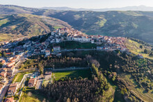Aerial View Of Ripacandida, A Small Town On The Hilltop With A Football Field In Foreground, Potenza, Basilicata, Italy.