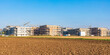 © Westend61 - Germany, Baden-Wurttemberg, Sindelfingen, Field with new development area in background
