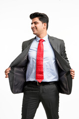 Wall Mural - Young indian businessman in classic suit giving expression on white background.