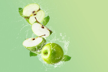 Sticker - Creative layout made from Green Apple and water splashing on a pastel green background. Fruit minimal concept and copy space.