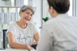 © SKW - Asian seniors who are healthy, in a good mood, smiling, talking with financial or life insurance staff to take care of life after retirement.