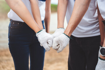 Group of asian teenage friends diverse people volunteer teamwork joining charity event to cleaning up garbage on public area ,Unity and team spirit on world environment day.