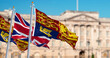 Royal Standard and United Kingdom flags waving in London