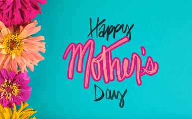 Wall Mural - Bright and cheerful happy mothers day greeting background with zinnia flower heads for holiday.