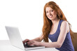 © vectorfusionart - Pretty redhead working on laptop