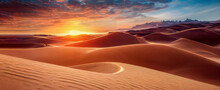 Panorama Banner Of Sand Dunes Sahara Desert At Sunset. Endless Dunes Of Yellow Sand. Desert Landscape Waves Sand Nature.